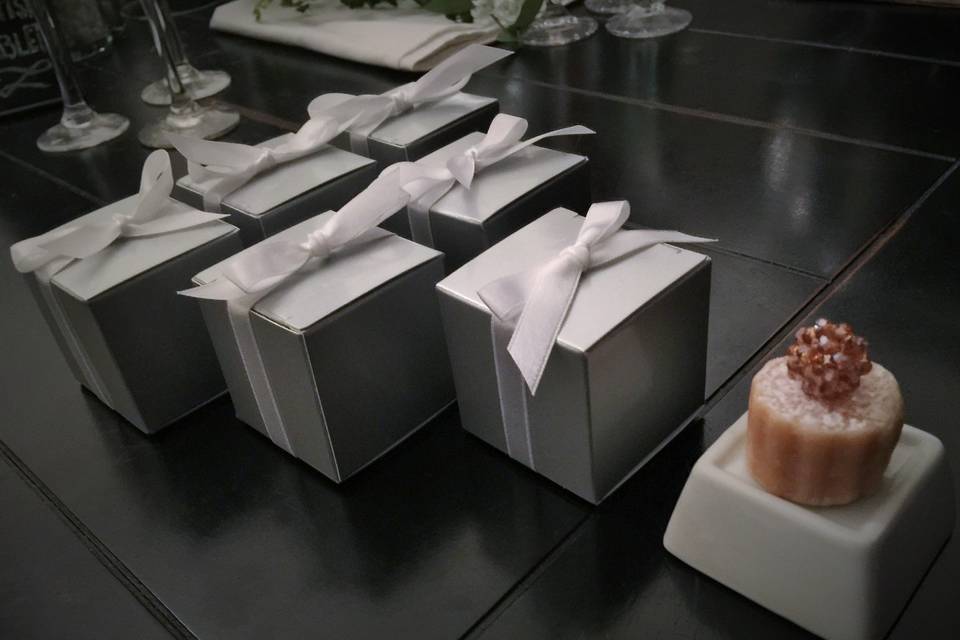 Cakes arrive individually boxed with a lovely hand tied satin ribbon and are suitable for service in or out of the clear box.
Contact us for personalized topper variety, availability and pricing.