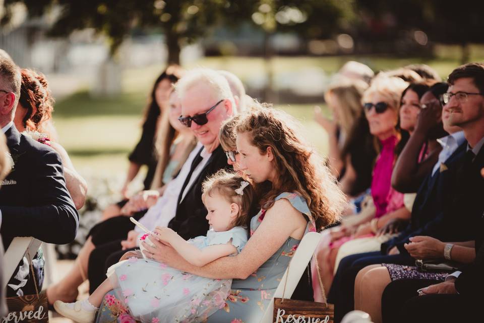 A guest and child during the ceremony