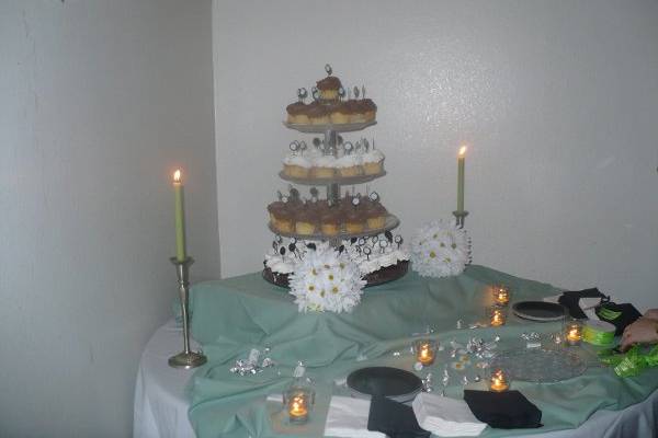 They had a grand cupcake tower, along with a beautiful small round cake to cut into.  The daisy balls tied in their theme.