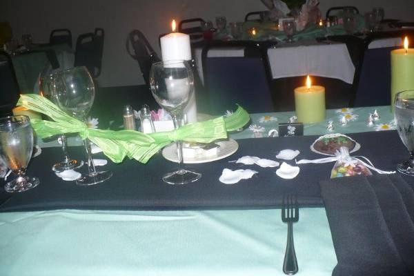 Another view of the sweetheart table, and the guest table across from it.  We used the potted daisies from the wedding ceremony as the centerpieces for the guest tables.  We added votive candles, and lots of silk rose petals to complement the natural beauty of the daisies.