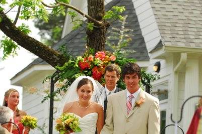 Bride with bridesmaids at staircase