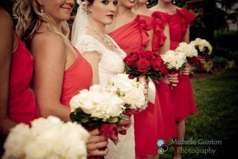 Bride with bridesmaids holding bouquet