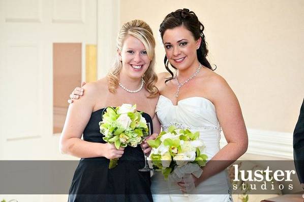 Bride with bridesmaids holding bouquet