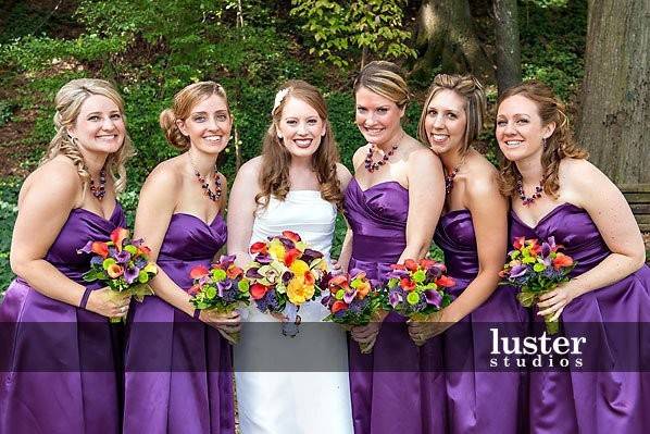 Bride with bridesmaids holding bouquet