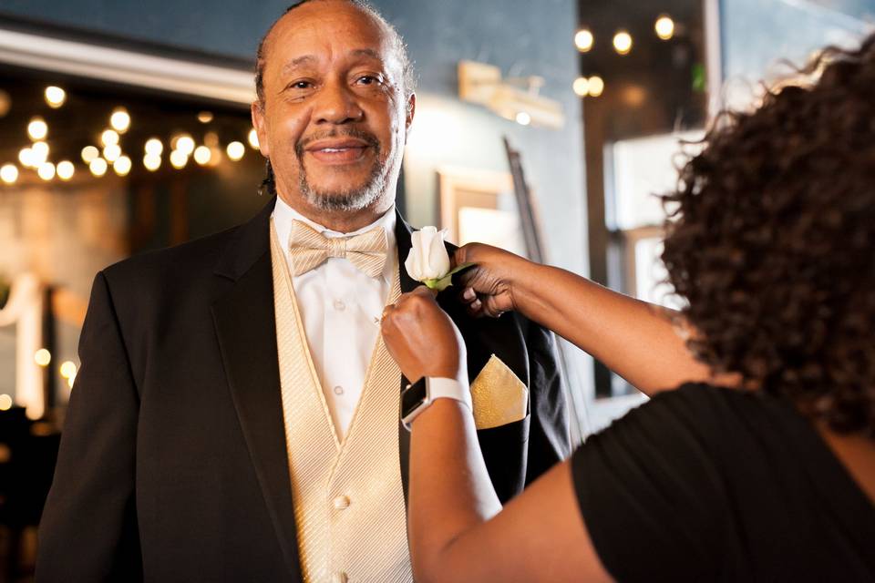 Wearing a boutonniere | Photo Credit ANM Photography