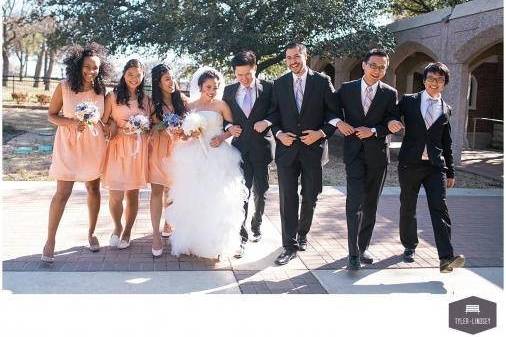 The couple with the bridesmaids and groomsmen