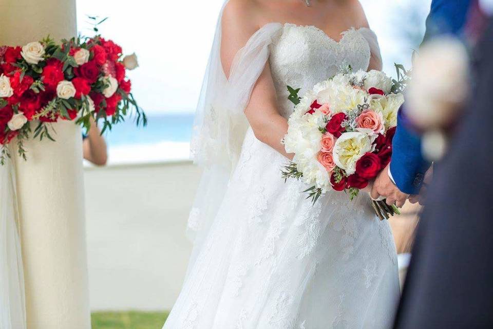 Bride holding a bouquet of roses