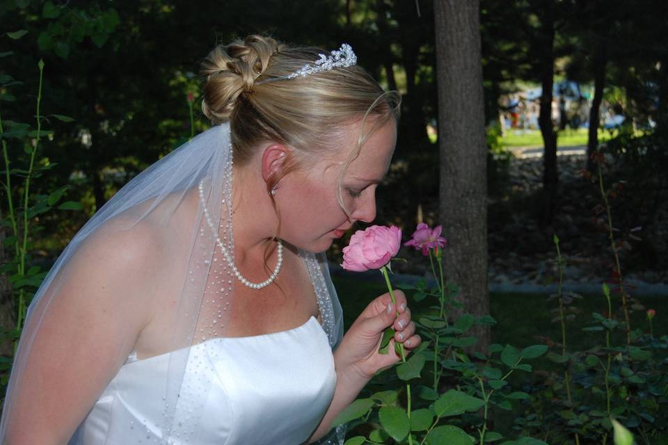 Bride smelling the roses