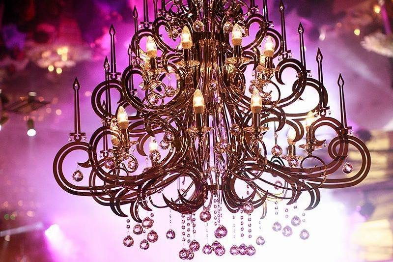 Chandelier and pink lighting at reception