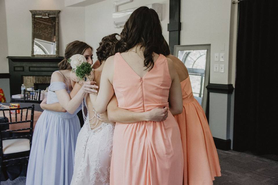 Bridal party hugs