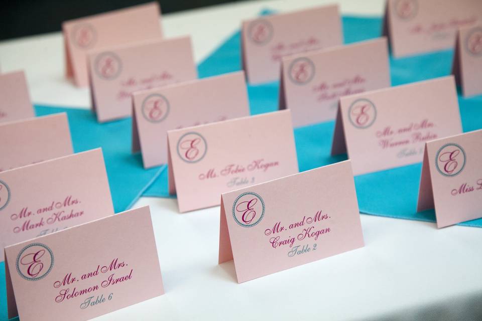 Pink monogram escort cards