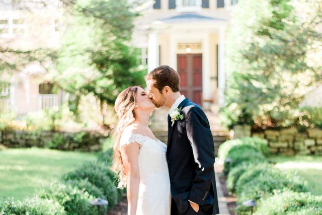 Couple kissing in a garden