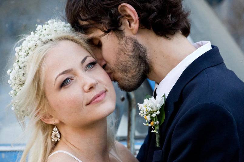 Groom gives his bride a kiss