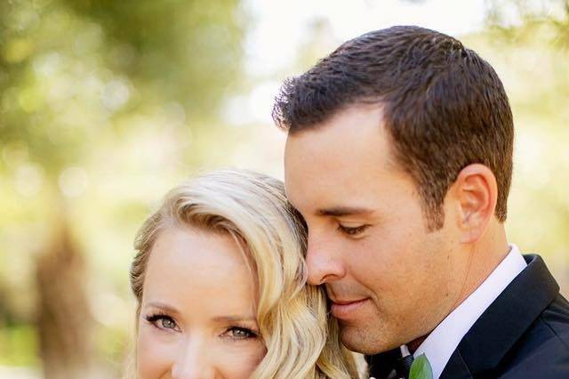 Groom embracing his bride