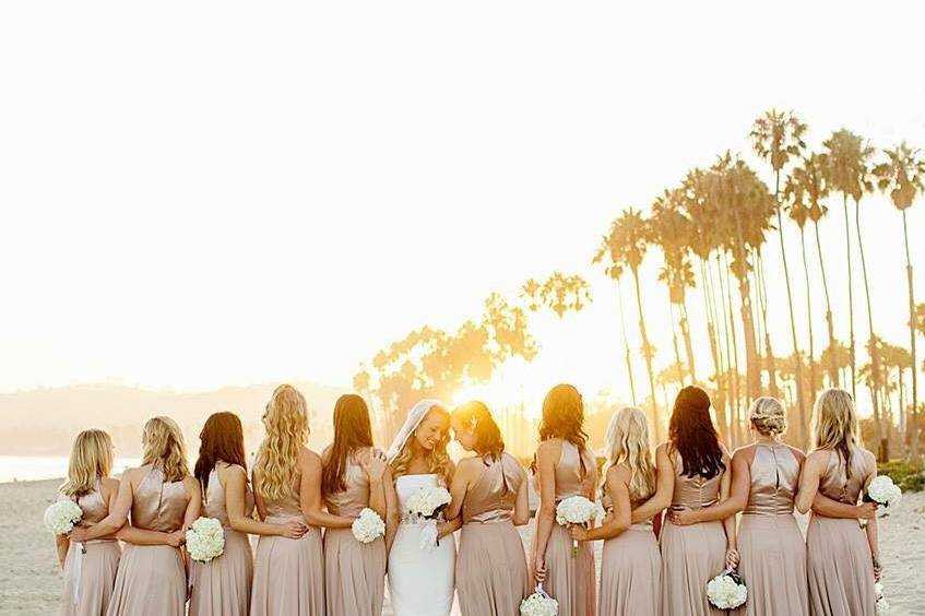 Bride and bridesmaids at the beach