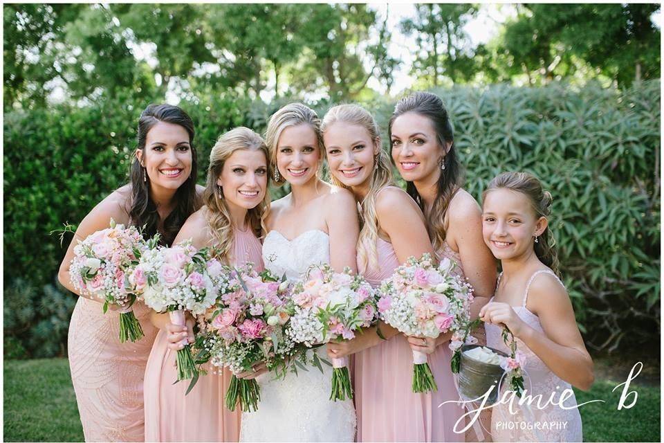 Bride, bridesmaids, and flower girl