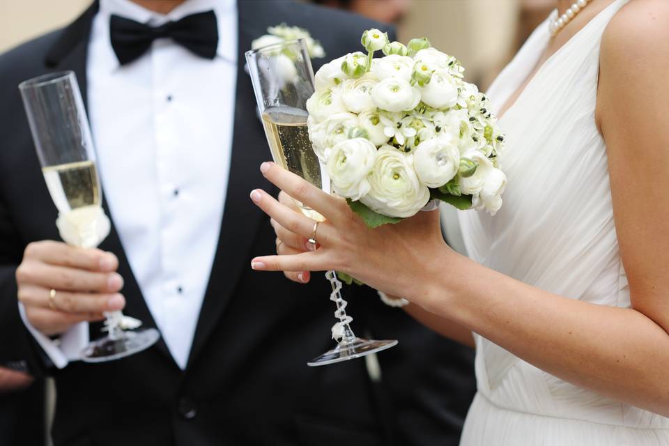 Champagne glass and bridal bouquet