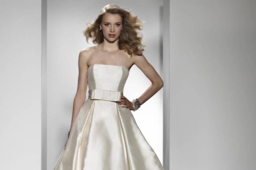 Style 9727This sweetheart neckline is adorned with beaded trim on this all embroidered and beaded tulle A-line gown. Satin buttons cover the zipper and cascade all the way to the end of the chapel length train.