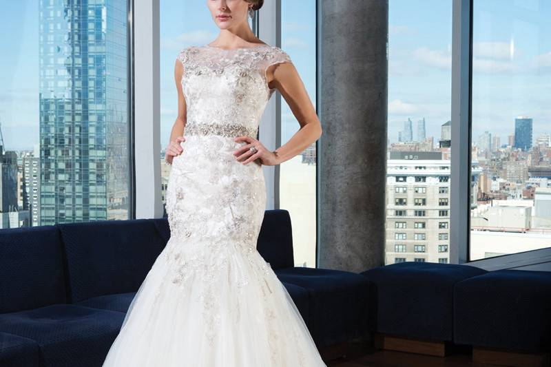 9766Tulle, organza, beading over embroidered lace fit and flare dress highlighted with a Sabrina neckline.