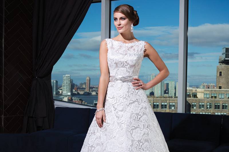 Style 9740Sequins, pearls, and bugle beads cover the sweetheart neckline and fullbodice on this mermaid gown. Tiered laser cut organza creates a softskirt and a sweep train. Fabric buttons cover the back zipper