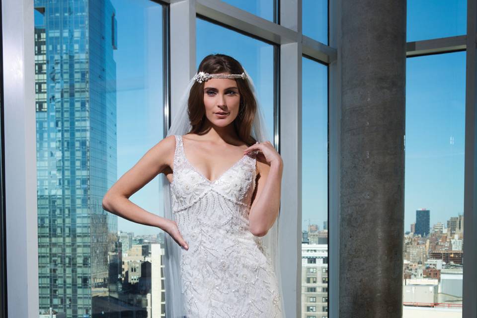 9860	<br>	A train fit for royalty. This ball gown features a sweetheart neckline, basque waistline, full sequin underlay, and a wrapped detachable train measuring 81 inches/205.7 centimeters in length. Available with a cathedral length train as style 9860C.