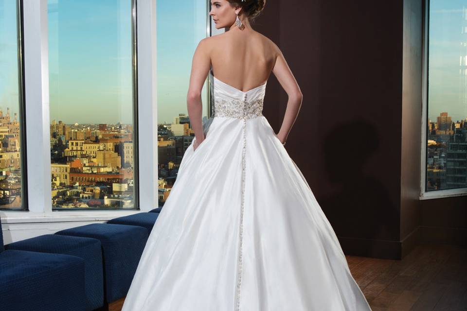 Style 9832 <br> Beaded illusion tulle Mandarin neckline, illusion back neckline, and sleeves, adorn this all over beaded tulle and lace fit and flare gown with a chapel length train.