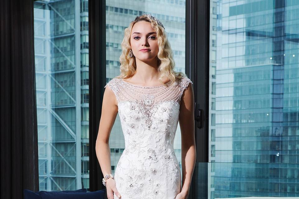 9856	<br>	Long sleeves have never looked as fierce as they do in this fit and flare lace, tulle, and Jersey lined gown with a Sabrina neckline, allover unique lace, illusion back, and buttons to the end of the monarch length train.