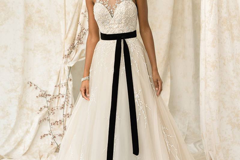 Justin Alexander Signature	9900	<br>	Designer hand beadwork adds a unique finish to this jewel neckline and A-line skirt. Hand beading trims the illusion keyhole back with button and loop closures. At the waist a detachable velvet belt adds drama.