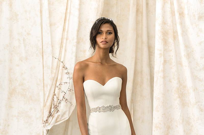 Justin Alexander Signature	9903	<br>	Simple elegance is created in this drop waist Luxe Satin gown. A full tulle skirt gives you dramatic movement. Shown with hand beaded belt to accent your waist.