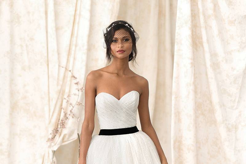 Justin Alexander Signature	9909	<br>	Fashion forward.  Your day will be complete in this scattered sequin tulle ball gown with a wrapped tulle bodice and detachable velvet self tie belt at your natural waist.