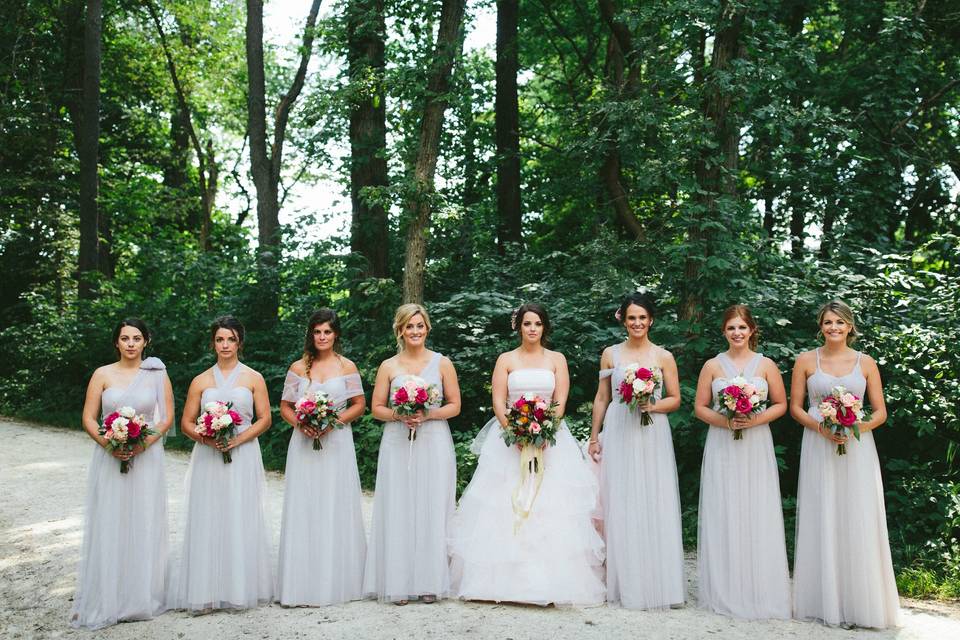 Bridal party with bouquets in hand