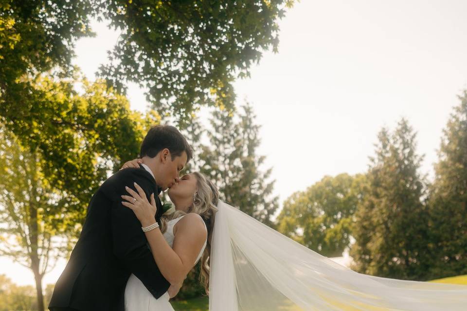 Bride and groom with veil