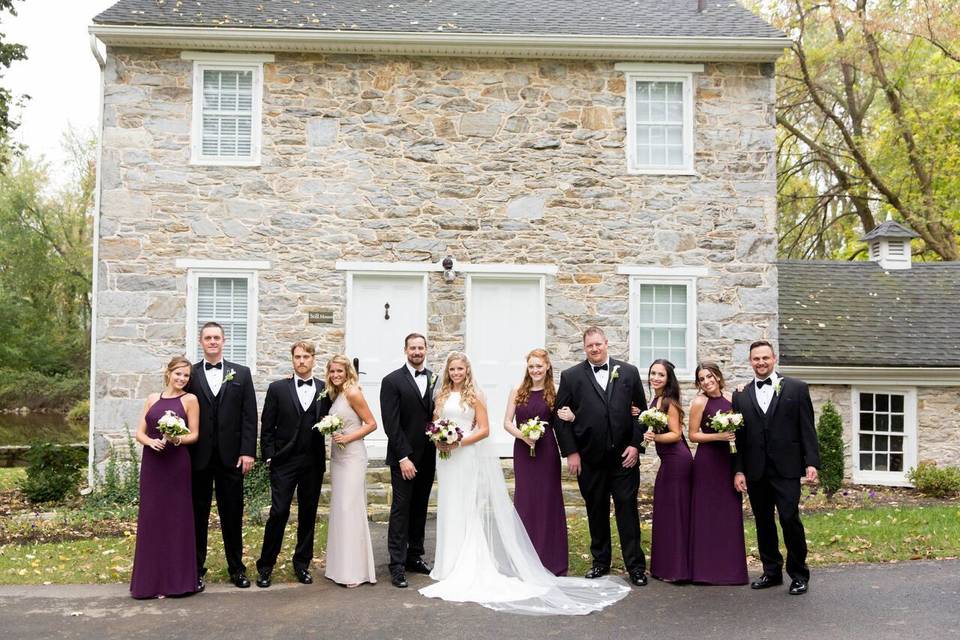 The couple with the bridesmaids and groomsmen