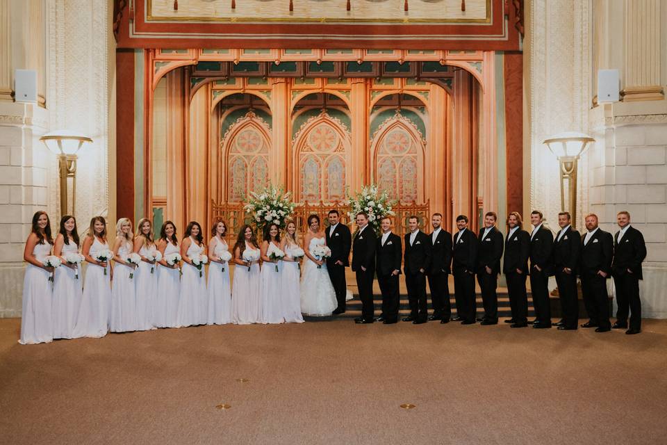 The couple with the bridesmaids and groomsmen