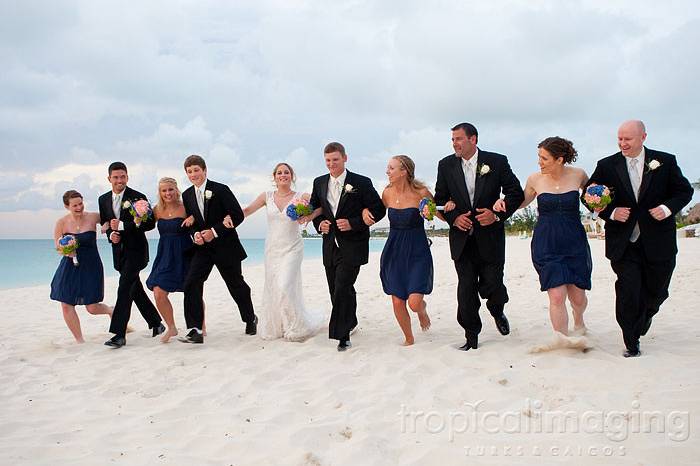 The entire bridal party enjoys a piece of paradise on the beautiful Grace Bay beach - Turks and Caicos