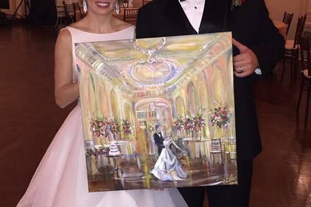 Bride and groom with their painting
