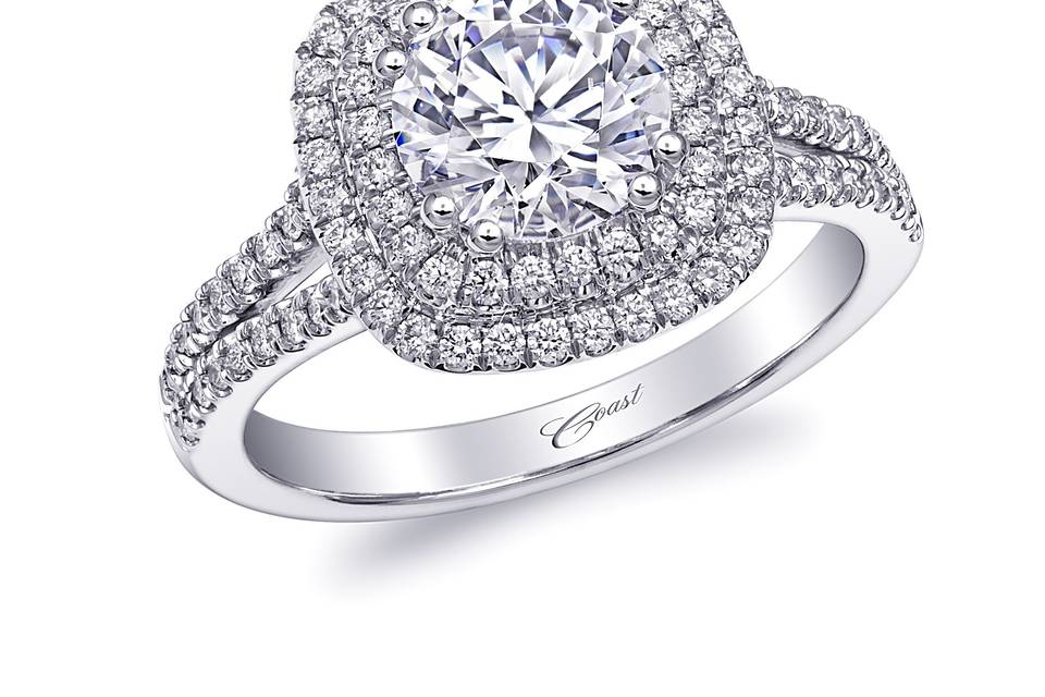 Style Engagement Ring (LC10130)	<br> This gorgeous double halo engagement ring makes a sparkling statement. A split shank of diamonds hugs the finger on either side. Shown with a 1.25CT center stone. Available in center stone of your choice.