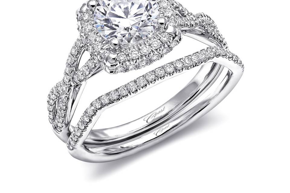 Style Engagement Ring (LC5457) Wedding Band (WC5457) <br> This sophisticated engagement ring features a cushion shaped halo of diamonds, framed by strings of diamonds which twist down the sides of the finger. The matching diamond band is contoured to fit perfectly against the engagement ring, creating a stunning wedding set. Built for a 1CT center stone (sold separately). Available in center stone of your choice.