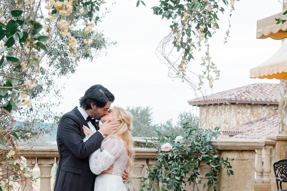 Couple kissing on balcony