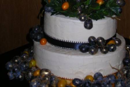 Fresh grapes were guilded to make this special cake, fit for a princess and prince.