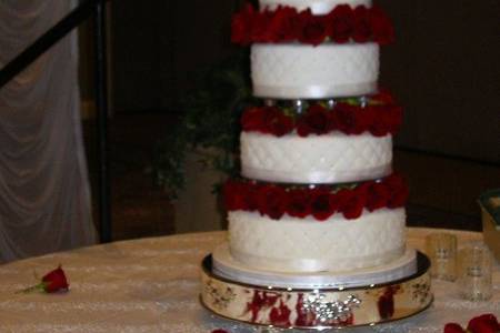 All six tiers of this enormous cake were made of Red Velvet cake and cream cheese butter cream filling.  The red roses made a lovely accompaniment to the red cake.