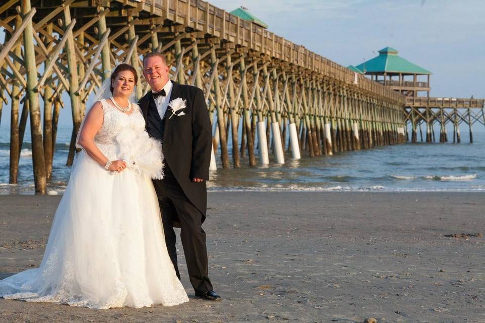 Newlyweds by the beach