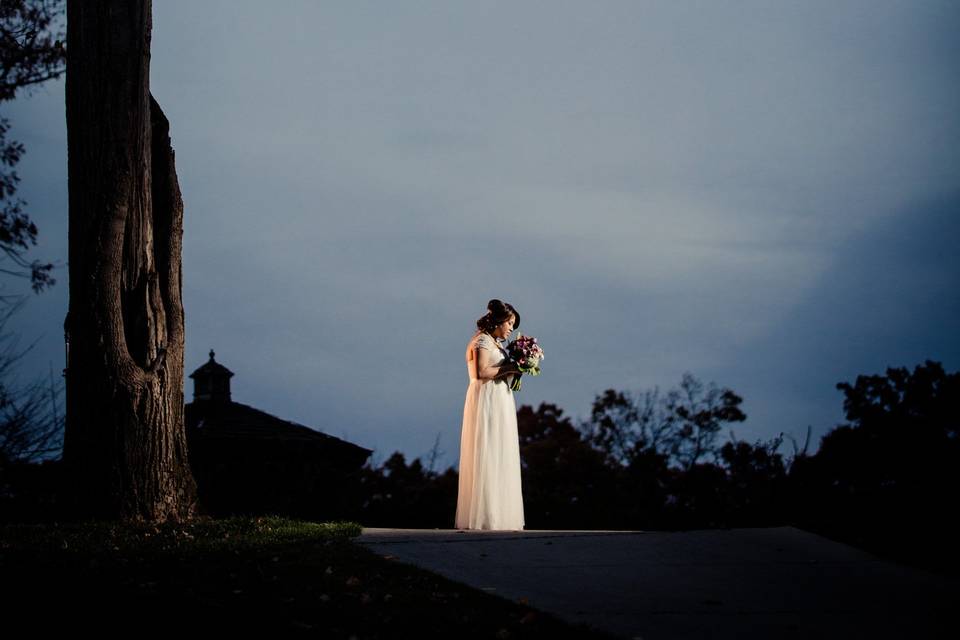 Fall Night Shot of Bride Near Gazebo and Tree