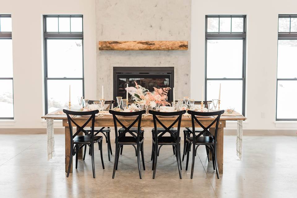 The fireplace, table & chairs