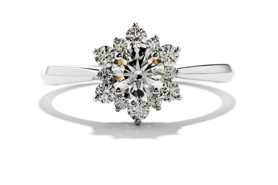 <b>Delight Lady Di Solitaire Diamond Engagement Ring</b><br>Baroque radiance glows from Lady Di's Hearts On Fire diamonds. Available in 18K white gold or platinum.</br>