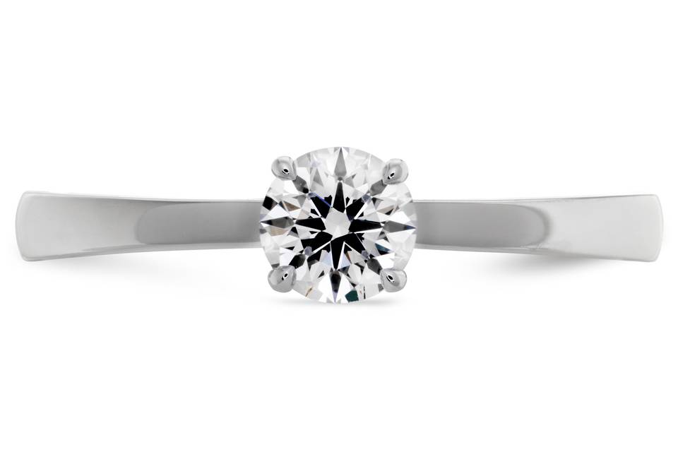 Hearts On Fire Signature Solitaire Engagement Ring<br>
This solitaire engagement ring is a true classic and consistent best-seller with its elegant, simple style. Perfect for any woman who wants her diamond to truly stand out, the HOF Signature Engagement Ring also includes hearts on its gallery that give even more meaning to this beautiful ring. Available in a variety of carat weights and metal types, including platinum as well as white, yellow and rose gold.
