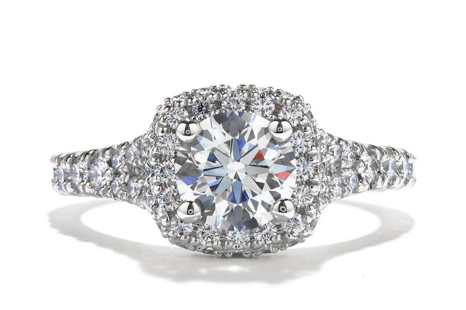 Acclaim Engagement Ring<br>
A diamond encrusted band and crown create the perfect center stage for our perfectly cut Hearts On Fire diamond.