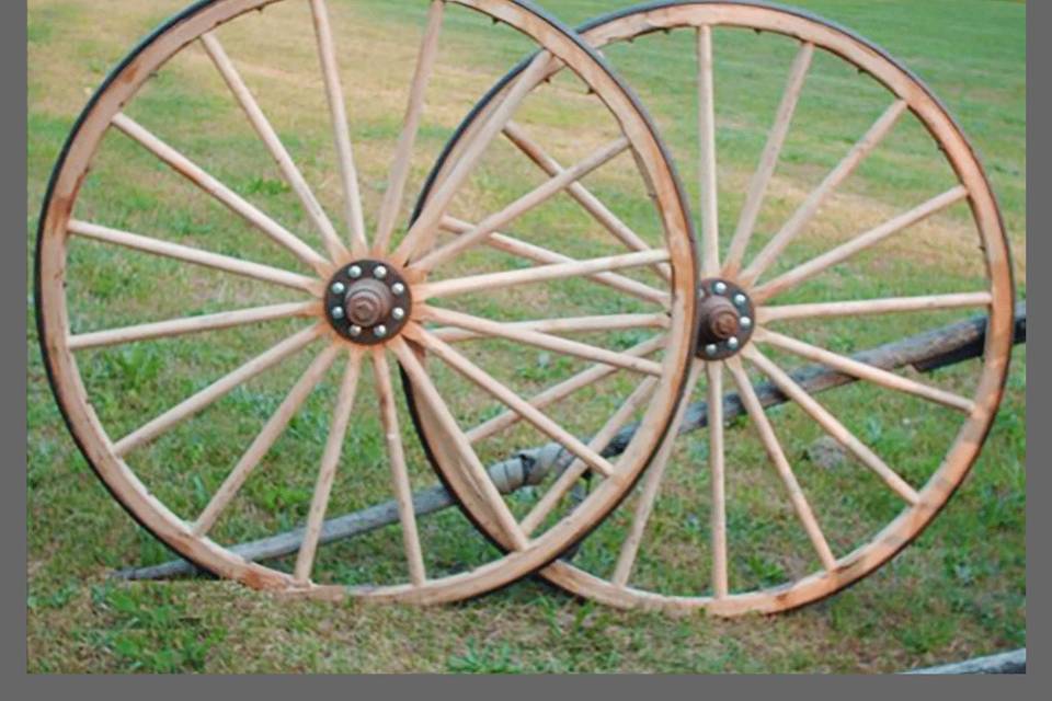 To create a covered wagon, we placed two wagon wheels in front of a wood table, designed and manufactured a fabric top and used it for the desert table. With a little creativity and the right items you can have anything you want.