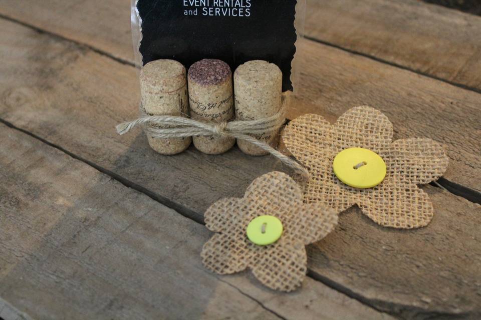 Burlap flowers and wine bottle cork table number holder.