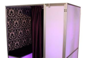 Boardwalk style photo booth. Comes with unlimited prints, custom photo border, props to take pictures with, and a memory book.